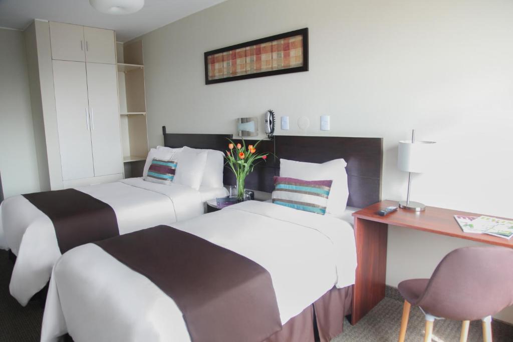 Postel nebo postele na pokoji v ubytování Hotel Rivera Inn