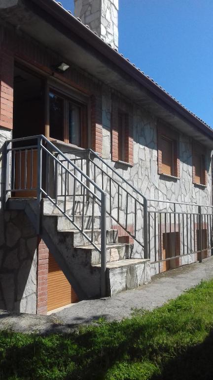 a building with a staircase on the side of it at Casas Valleiruelas in Las Cruceras