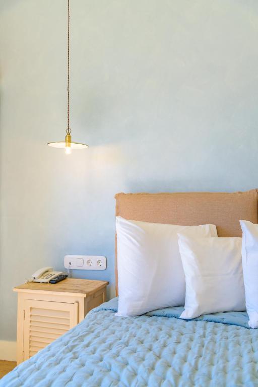Posteľ alebo postele v izbe v ubytovaní Panas Hotel