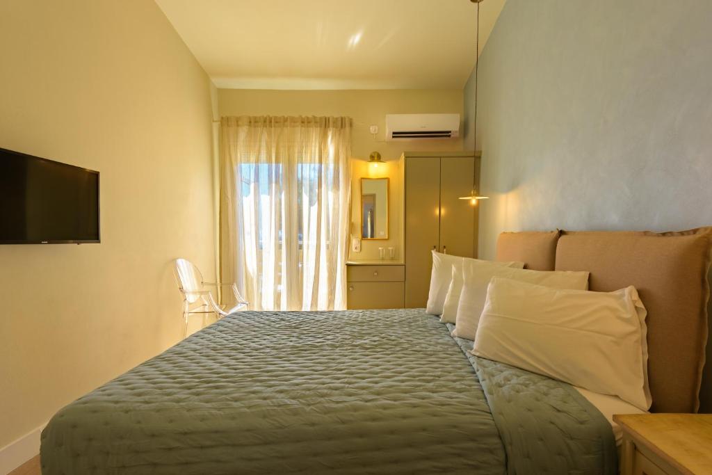 Posteľ alebo postele v izbe v ubytovaní Panas Hotel