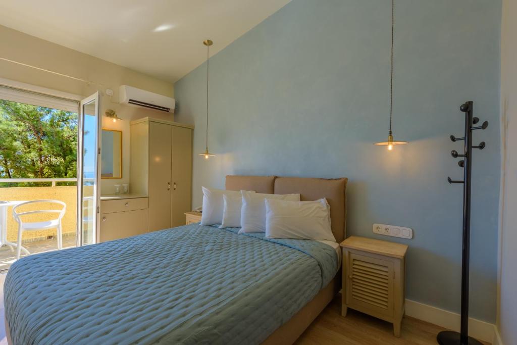 Posteľ alebo postele v izbe v ubytovaní Panas Hotel
