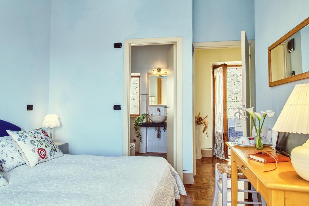 Postel nebo postele na pokoji v ubytování B&B Daria - Deb'S Monticchiello