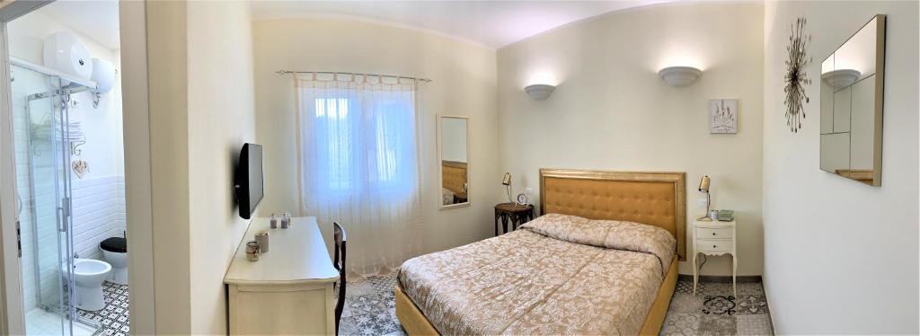 Letto o letti in una camera di B&B ALVINO