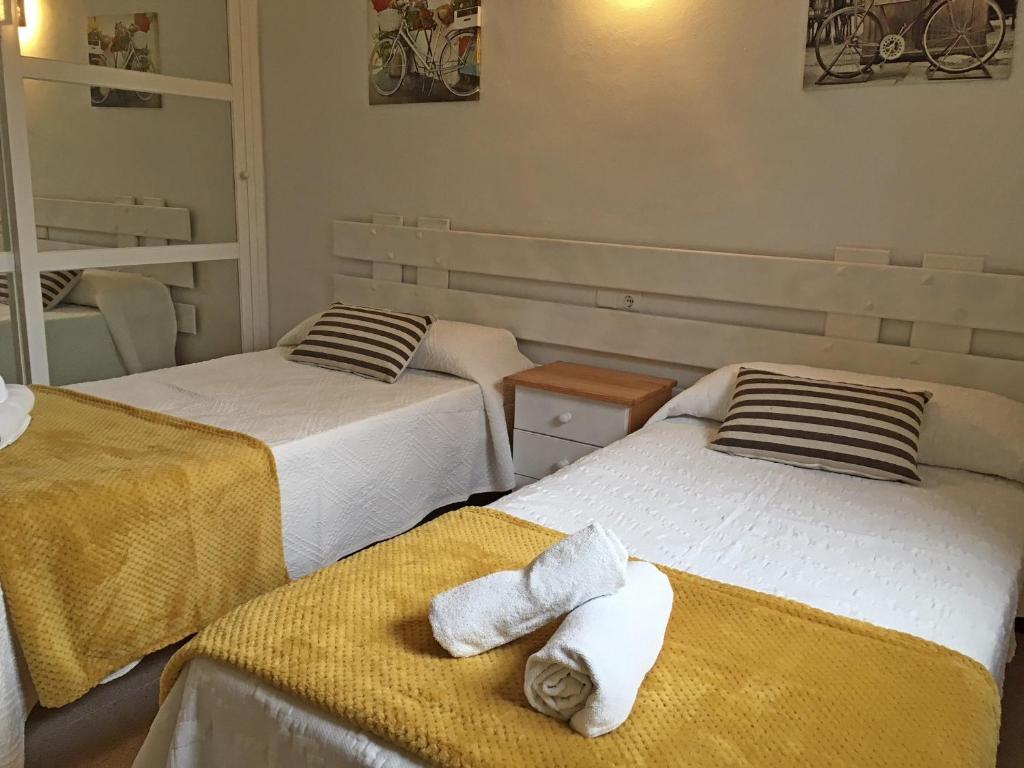 A bed or beds in a room at Viviendas Los Olivos - Formentera Break