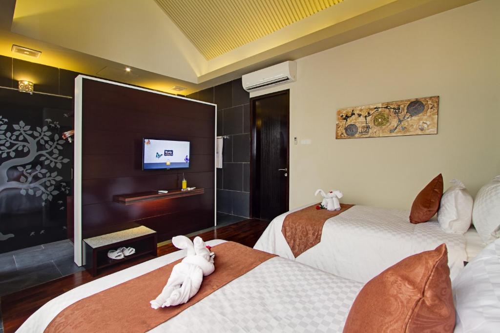 Кровать или кровати в номере 18 Suite Villa Loft at Kuta
