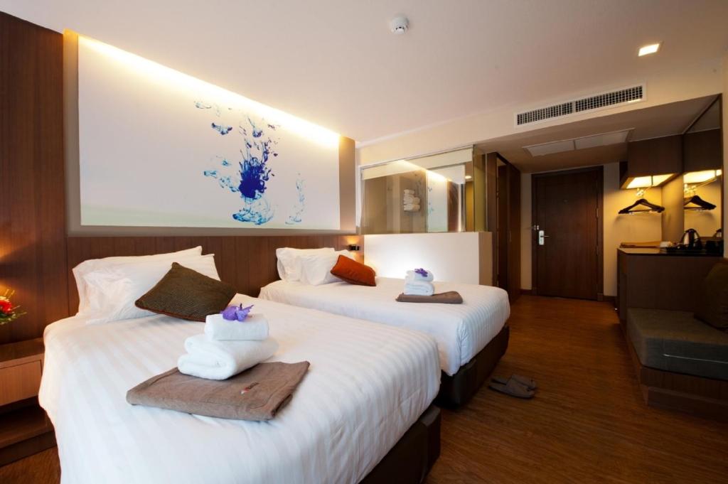 Postel nebo postele na pokoji v ubytování 41 Suite Bangkok
