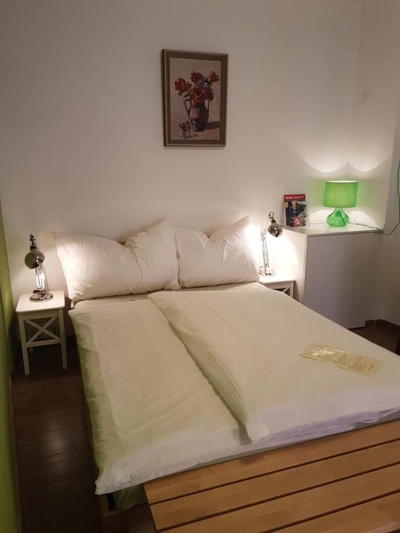 Postel nebo postele na pokoji v ubytování Garni Giacometti