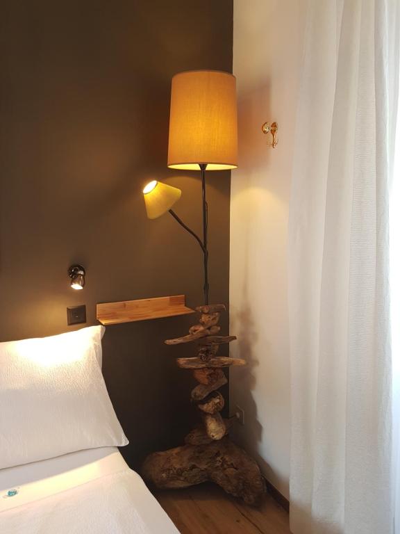 Postel nebo postele na pokoji v ubytování Garni Giacometti
