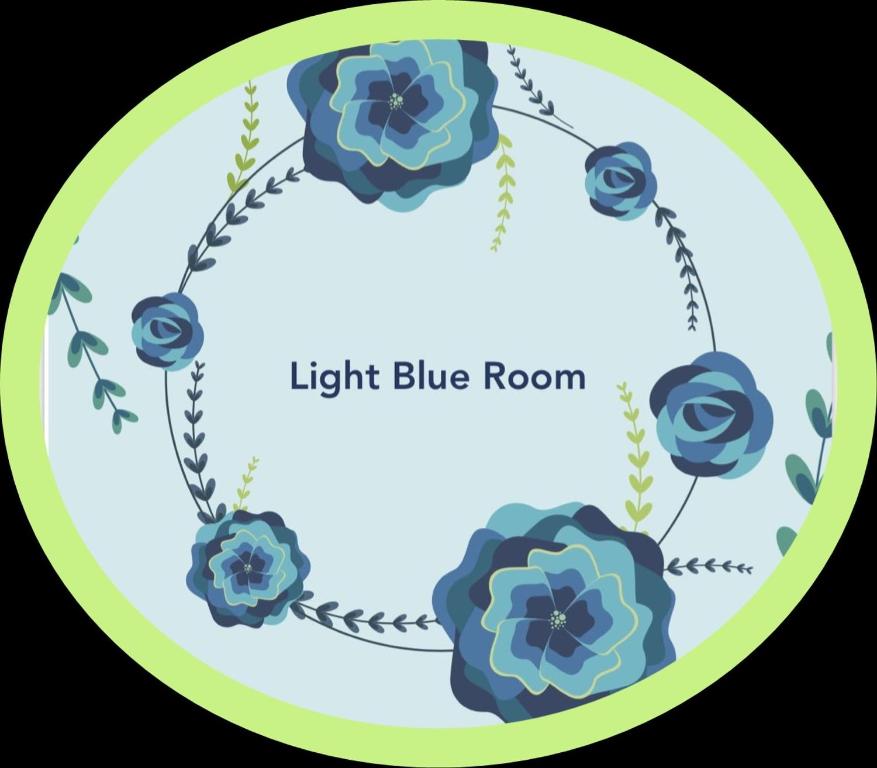 two blue roses in a green circle with the words right blue room at Light Blue Room in Scordia
