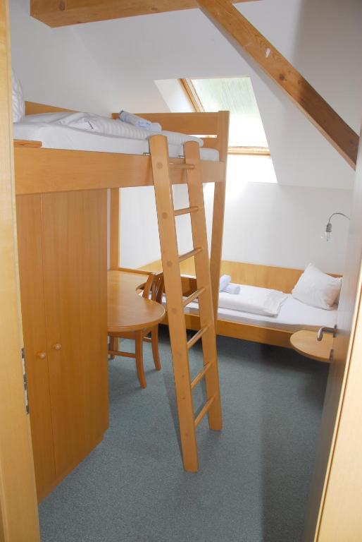 Postel nebo postele na pokoji v ubytování Alpenhotel Badmeister