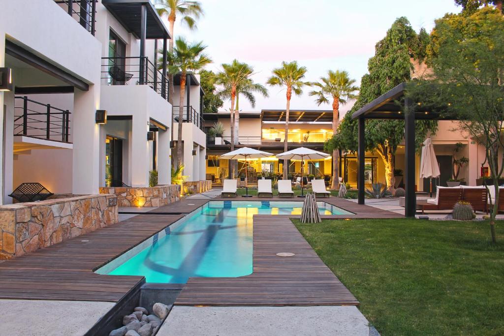 a swimming pool in the backyard of a house at Marsella 45 in Hermosillo