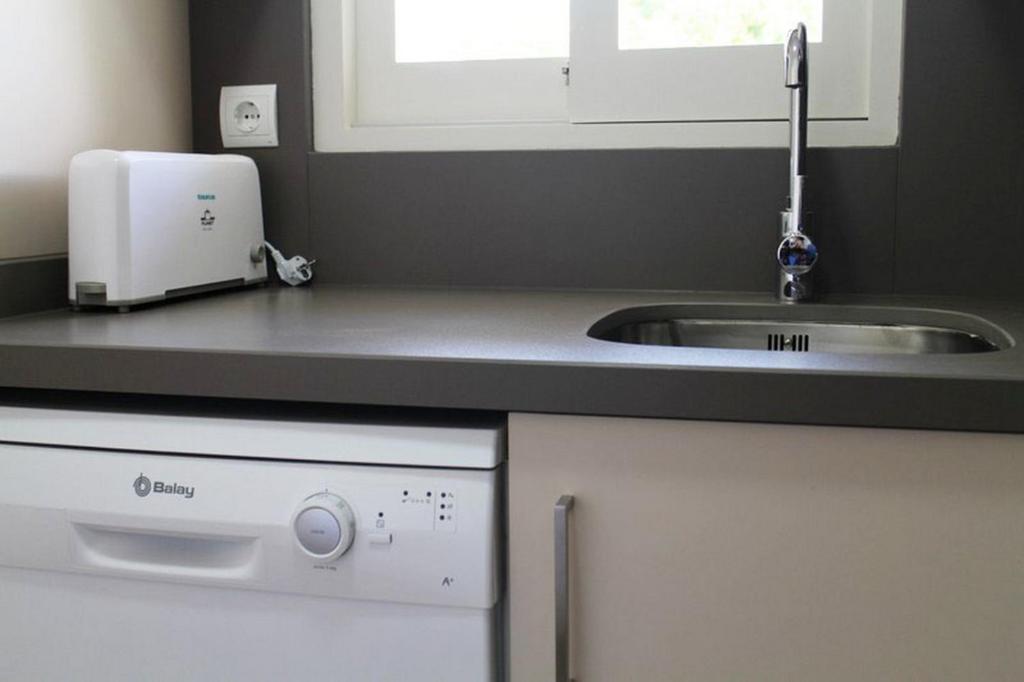 A kitchen or kitchenette at Es Daus - Formentera Break