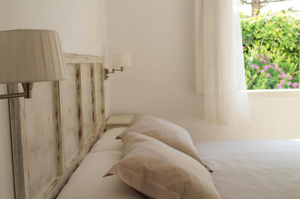 A bed or beds in a room at Es Daus - Formentera Break