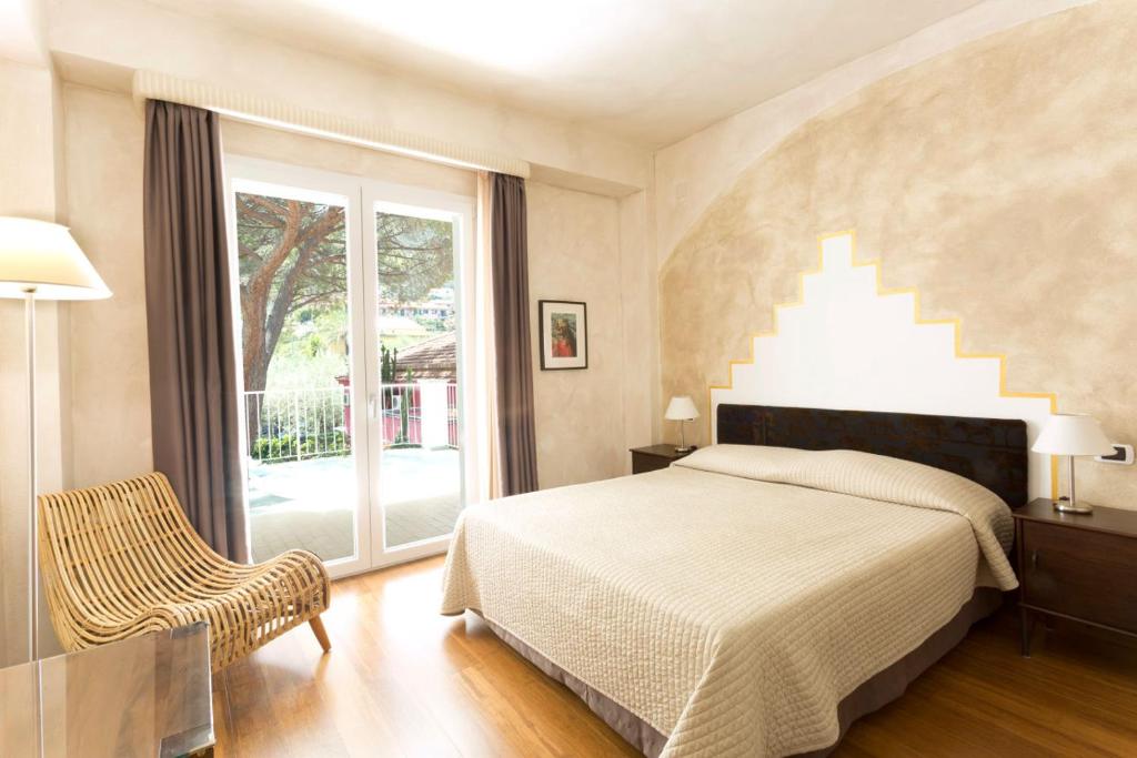 Кровать или кровати в номере Hotel Kalura