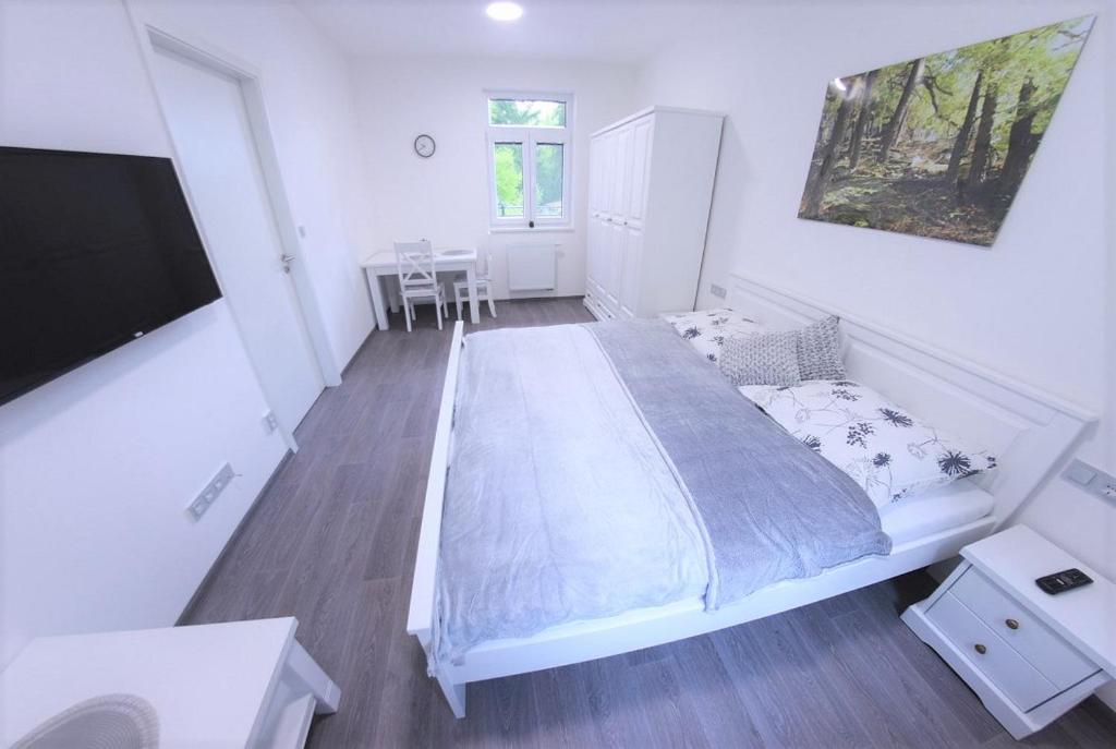 Postel nebo postele na pokoji v ubytování JM Apartments
