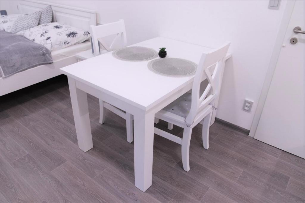 Postel nebo postele na pokoji v ubytování JM Apartments