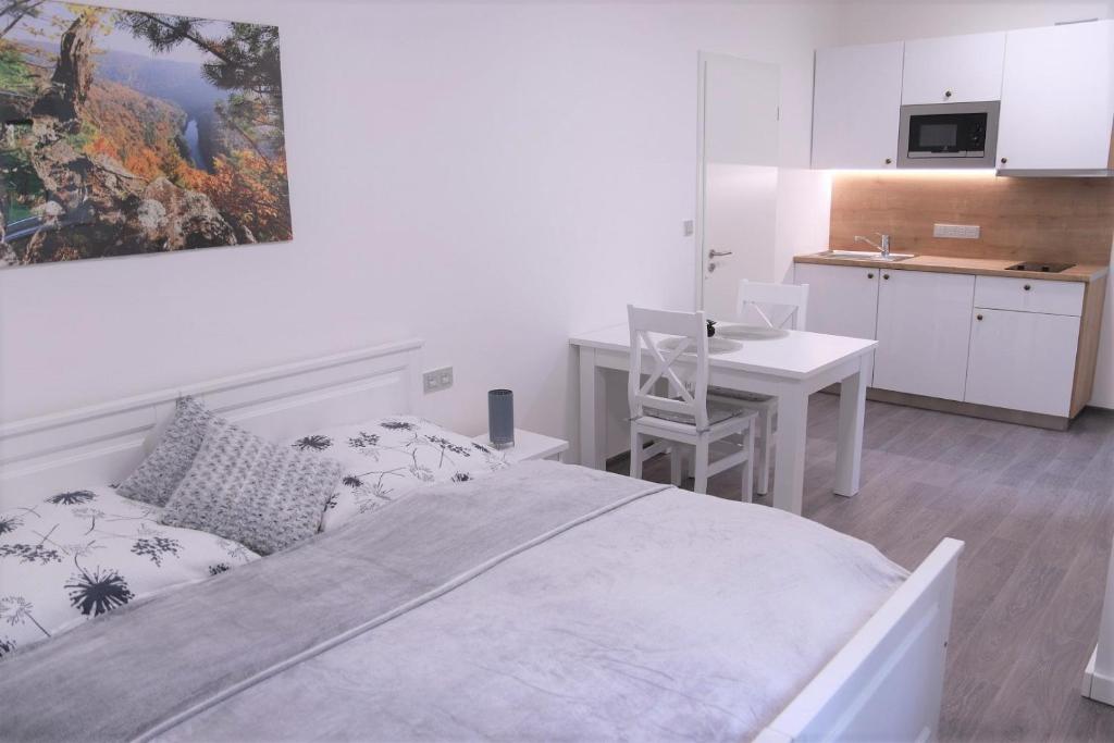 Kuchyň nebo kuchyňský kout v ubytování JM Apartments