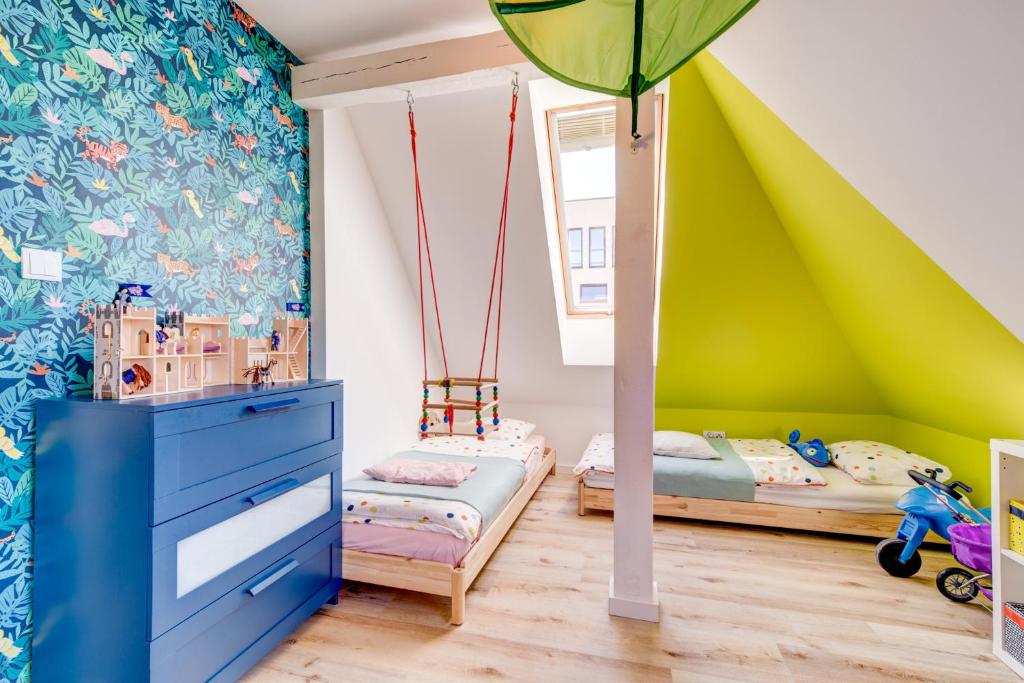 Ένα ή περισσότερα κρεβάτια σε δωμάτιο στο HM-Family-Apartment by Eve