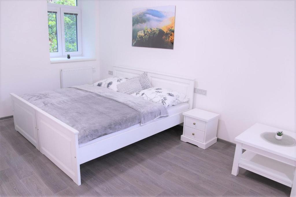 Postel nebo postele na pokoji v ubytování JM Apartments