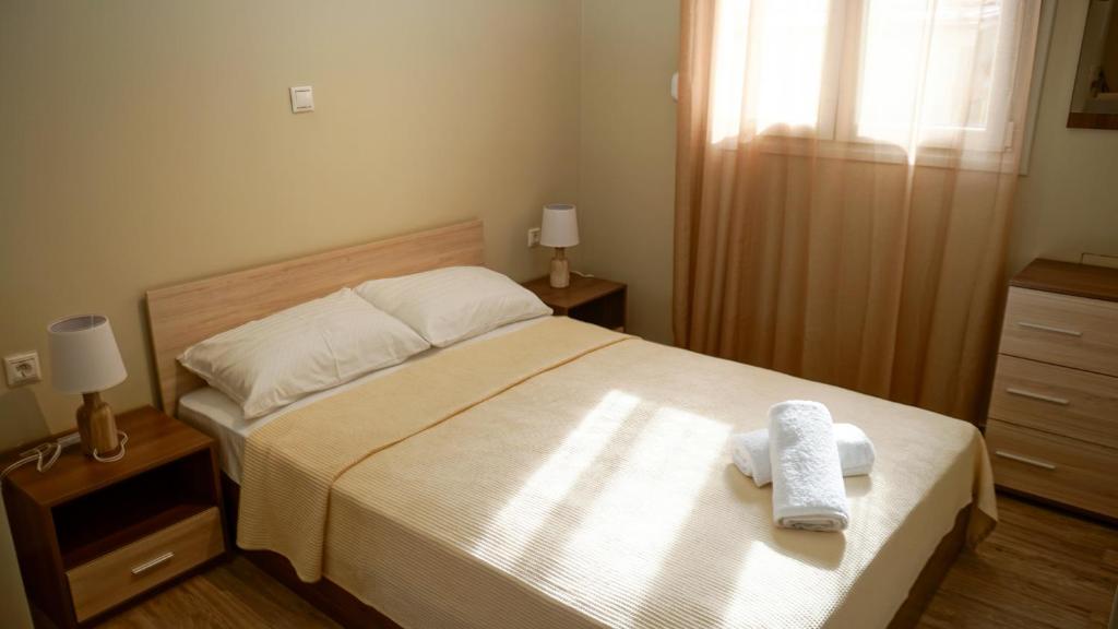 A bed or beds in a room at Stratonikis Apartments