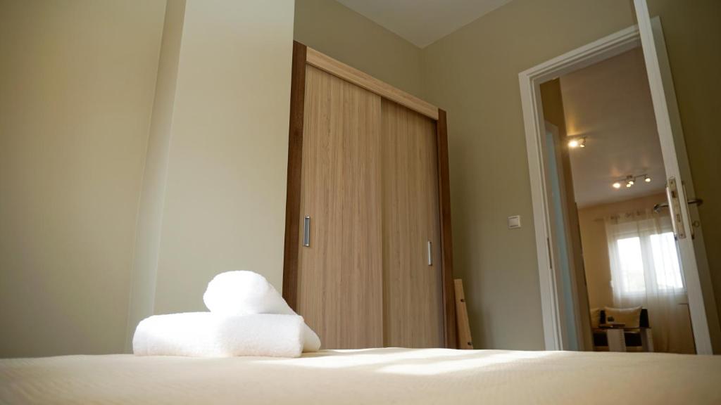 A bed or beds in a room at Stratonikis Apartments