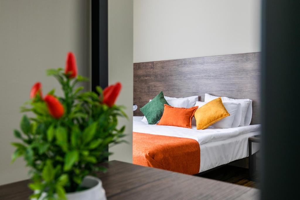 Postel nebo postele na pokoji v ubytování Boutique Hotel MOJO