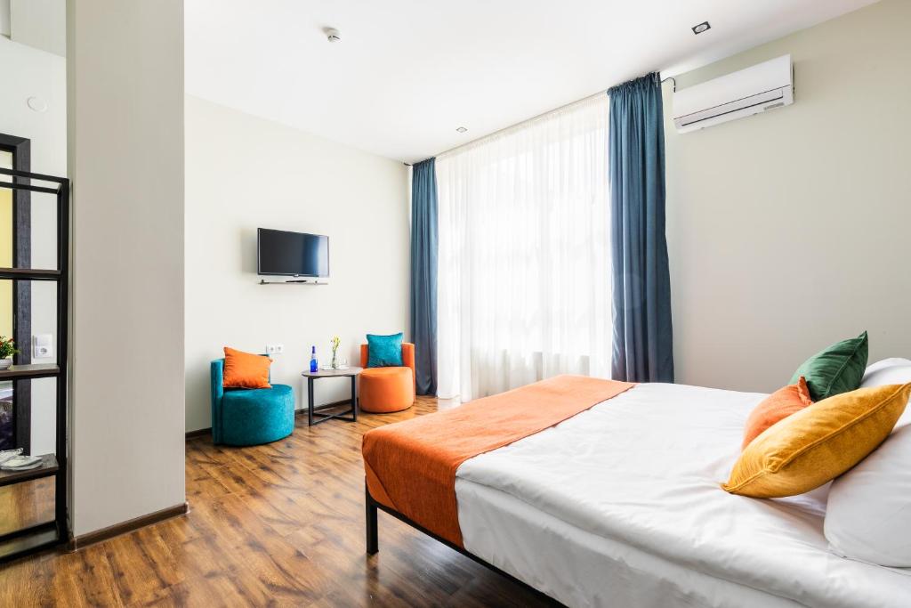 Postel nebo postele na pokoji v ubytování Boutique Hotel MOJO