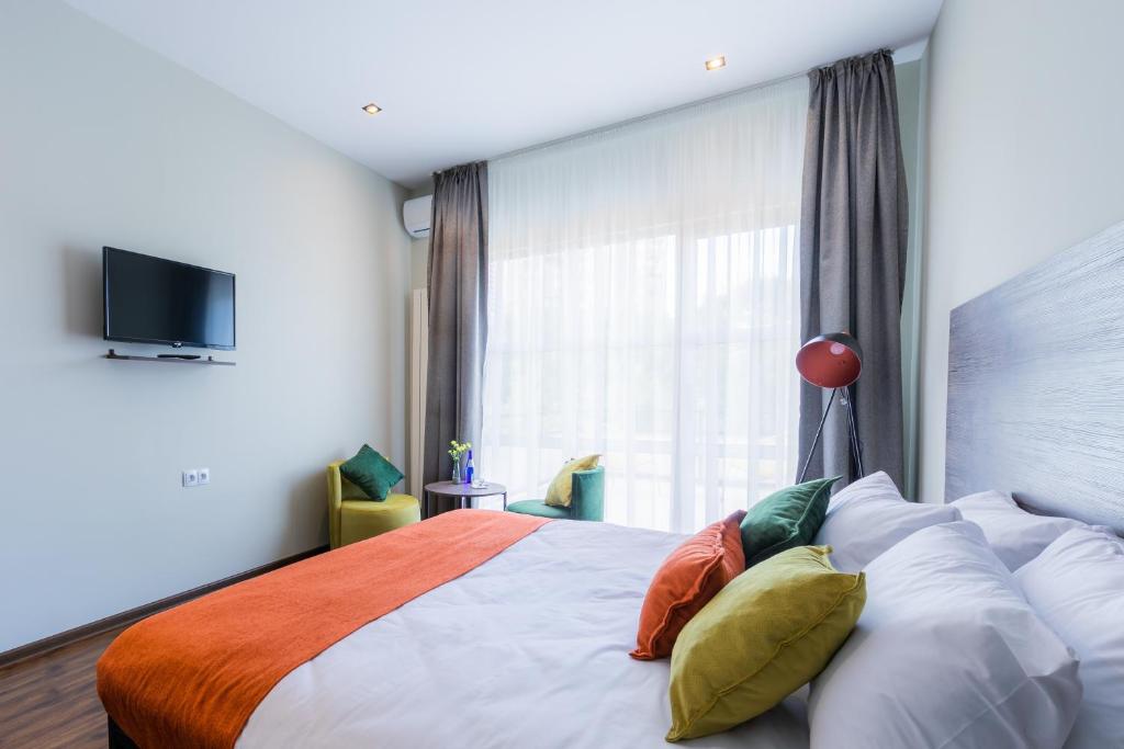 Postel nebo postele na pokoji v ubytování Boutique Hotel MOJO