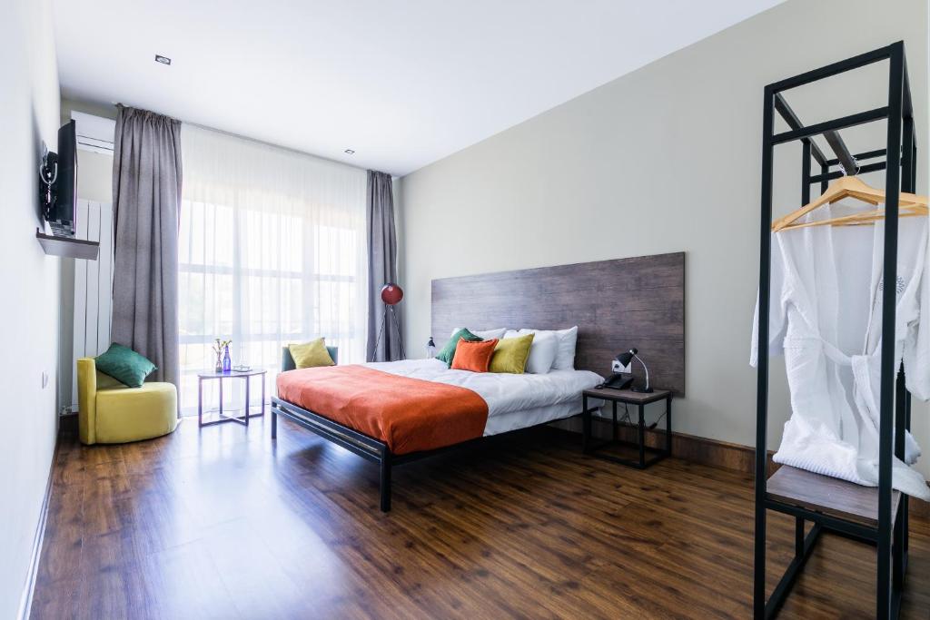 Postel nebo postele na pokoji v ubytování Boutique Hotel MOJO