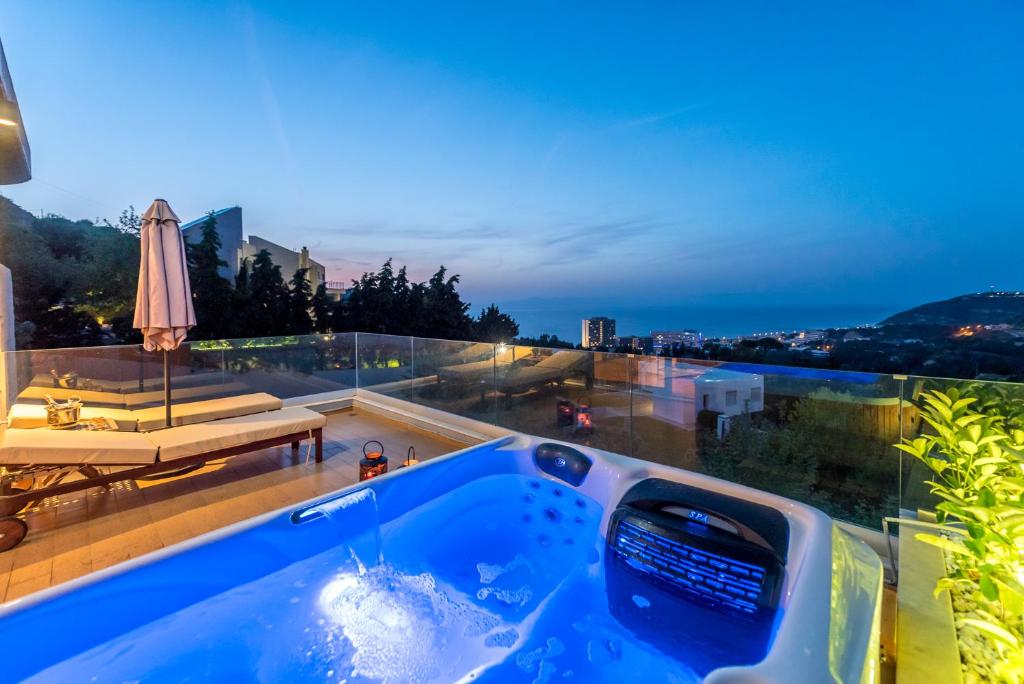 a jacuzzi tub on the roof of a house at FlyViewFlatsGOLD PrivateHotTub with SeaView in Rhodes Town