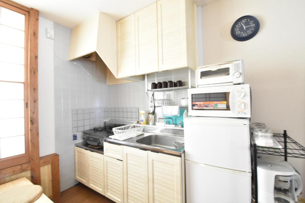 Kuchyň nebo kuchyňský kout v ubytování Condominio Mozu 102