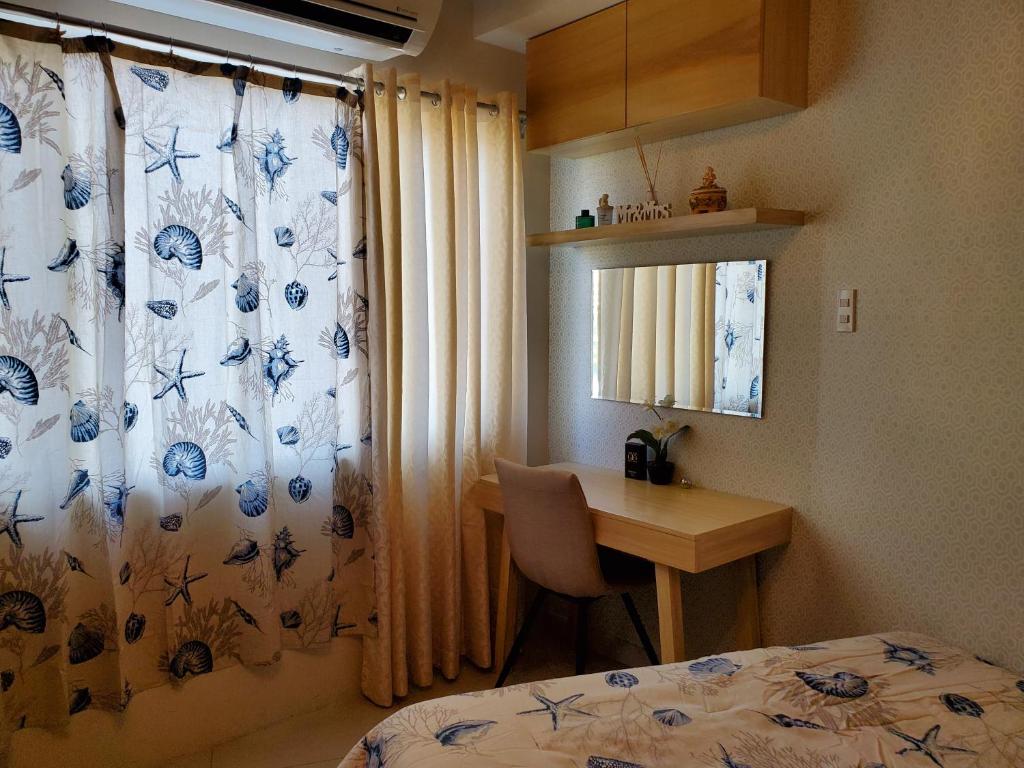 Postel nebo postele na pokoji v ubytování Shell Residence Manila