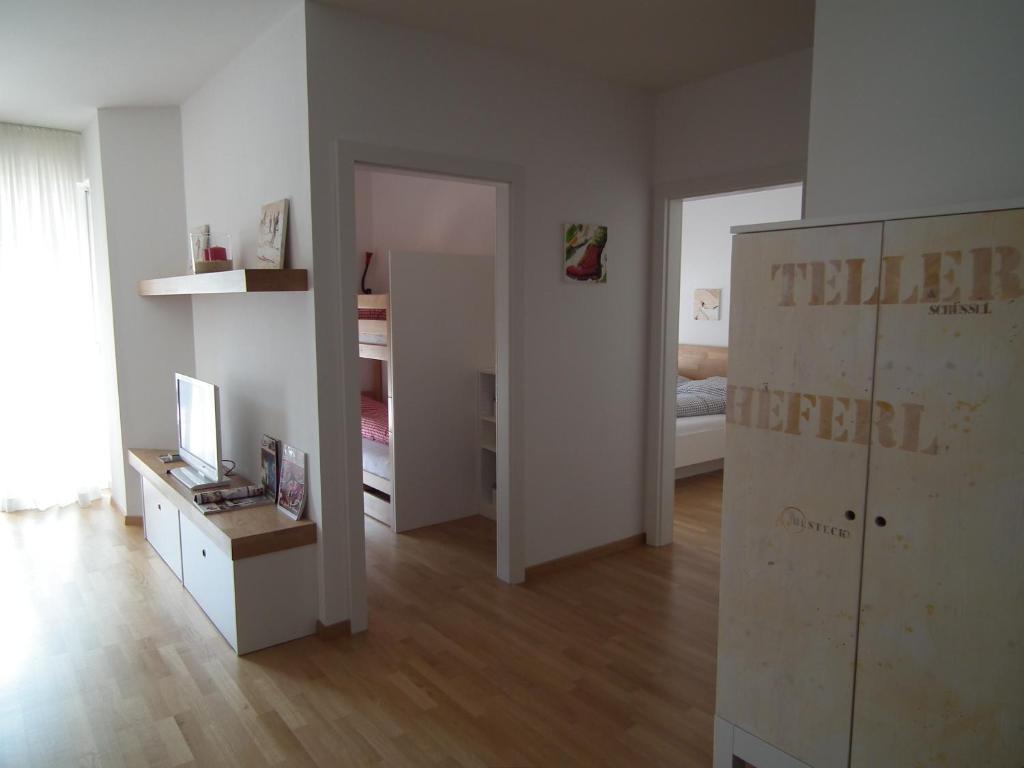 Postel nebo postele na pokoji v ubytování Nassfeld Apartments - "Traditionell anders"