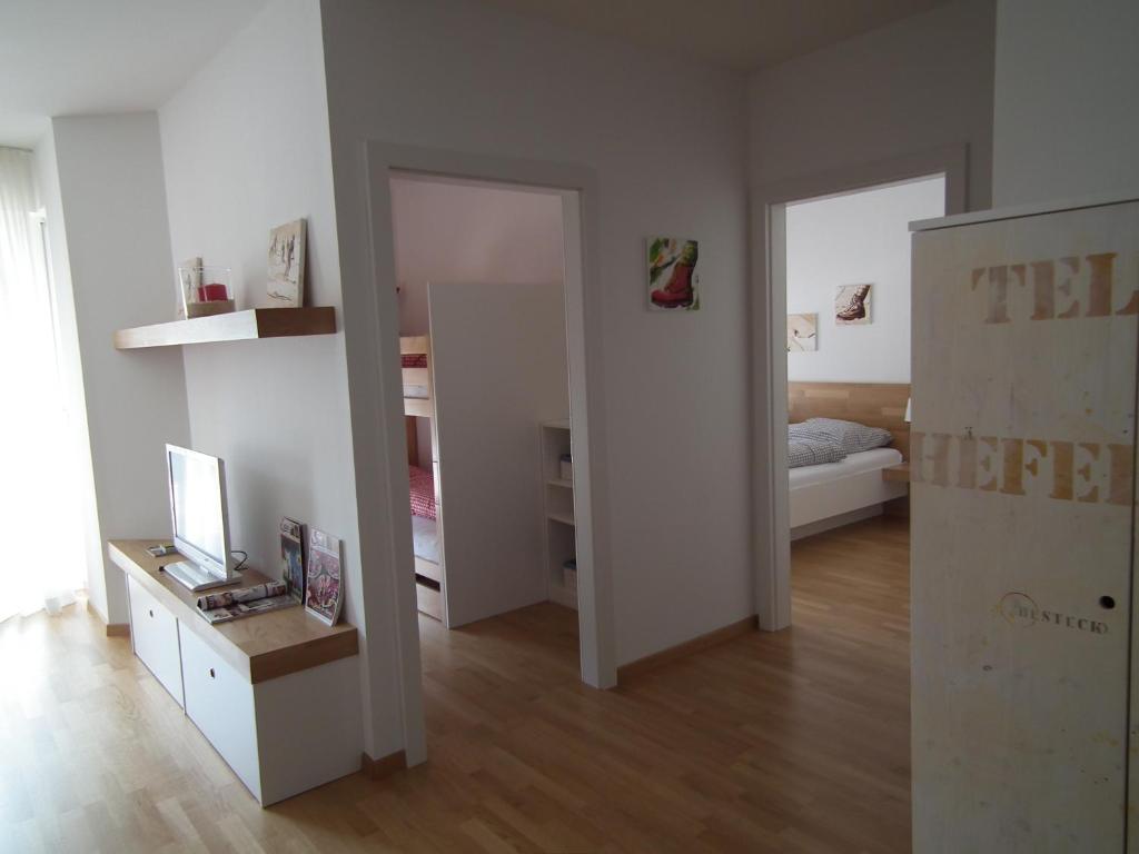 Postel nebo postele na pokoji v ubytování Nassfeld Apartments - "Traditionell anders"