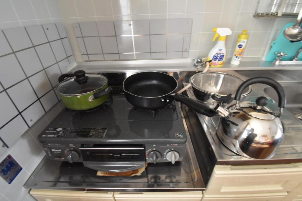 Kuchyň nebo kuchyňský kout v ubytování Condominio Mozu 102