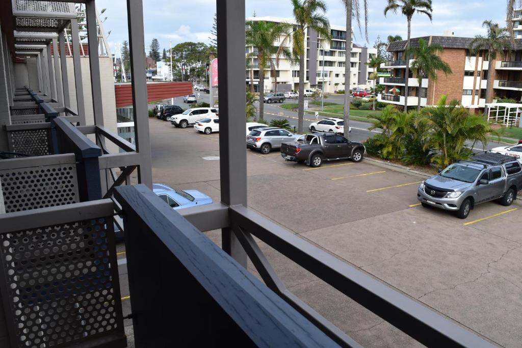 a balcony with cars parked in a parking lot at Comfort Resort Waters Edge in Port Macquarie