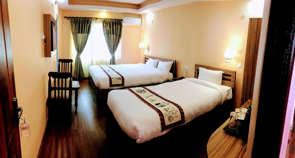 Postel nebo postele na pokoji v ubytování Kathmandu Garden Home