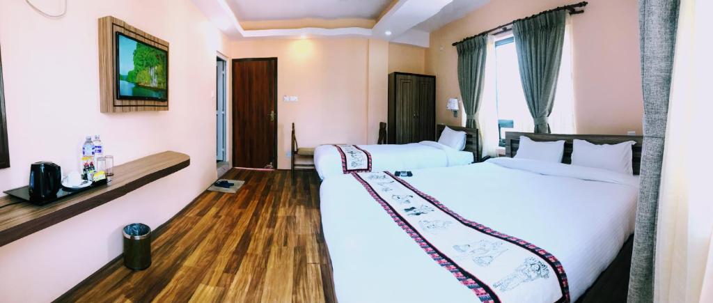 Postel nebo postele na pokoji v ubytování Kathmandu Garden Home
