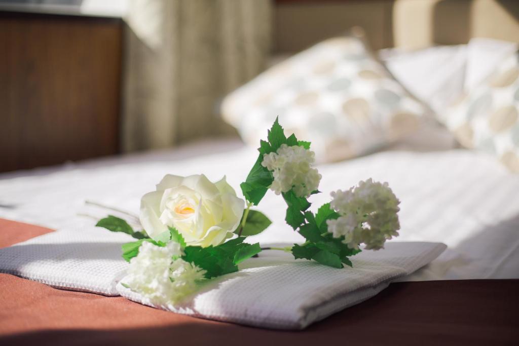 Postel nebo postele na pokoji v ubytování Tabata Oji Hotel
