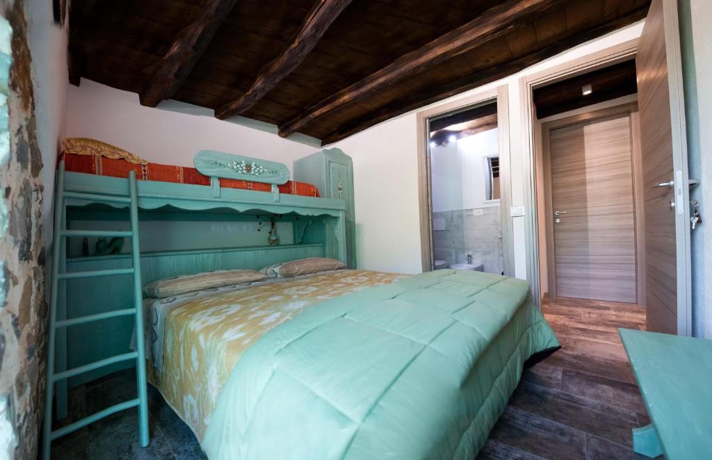 Łóżko lub łóżka w pokoju w obiekcie B&B Sopra il Portico