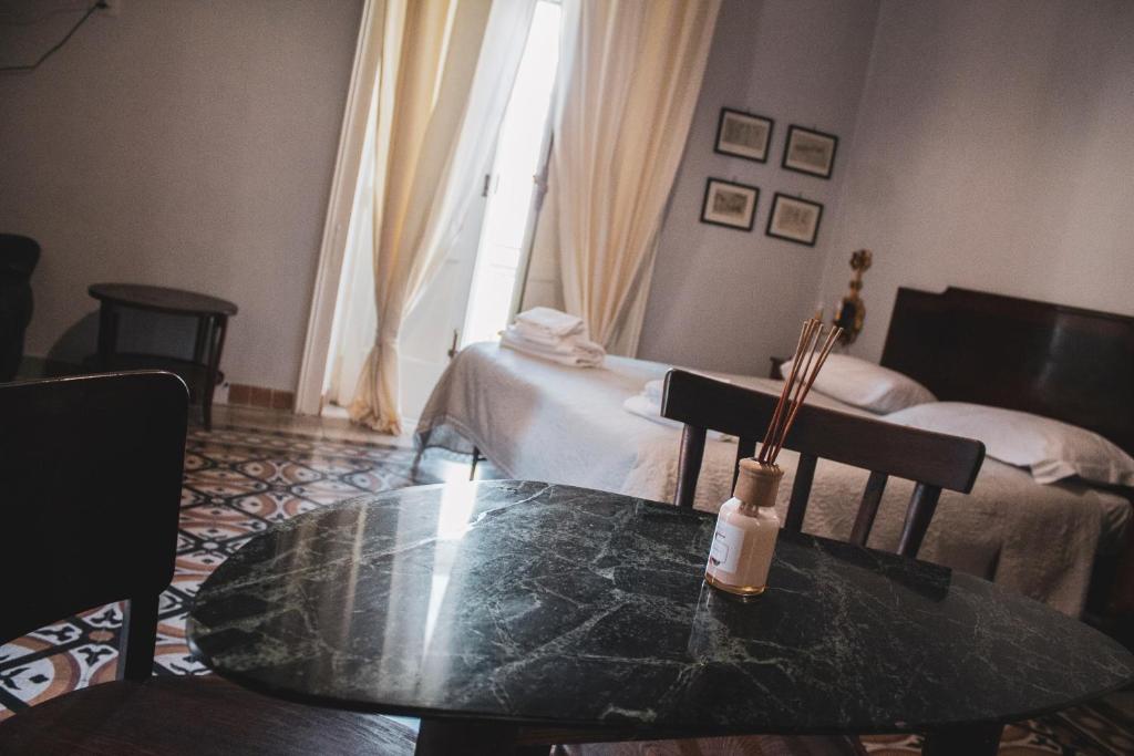 Postel nebo postele na pokoji v ubytování Borgo Civico 10