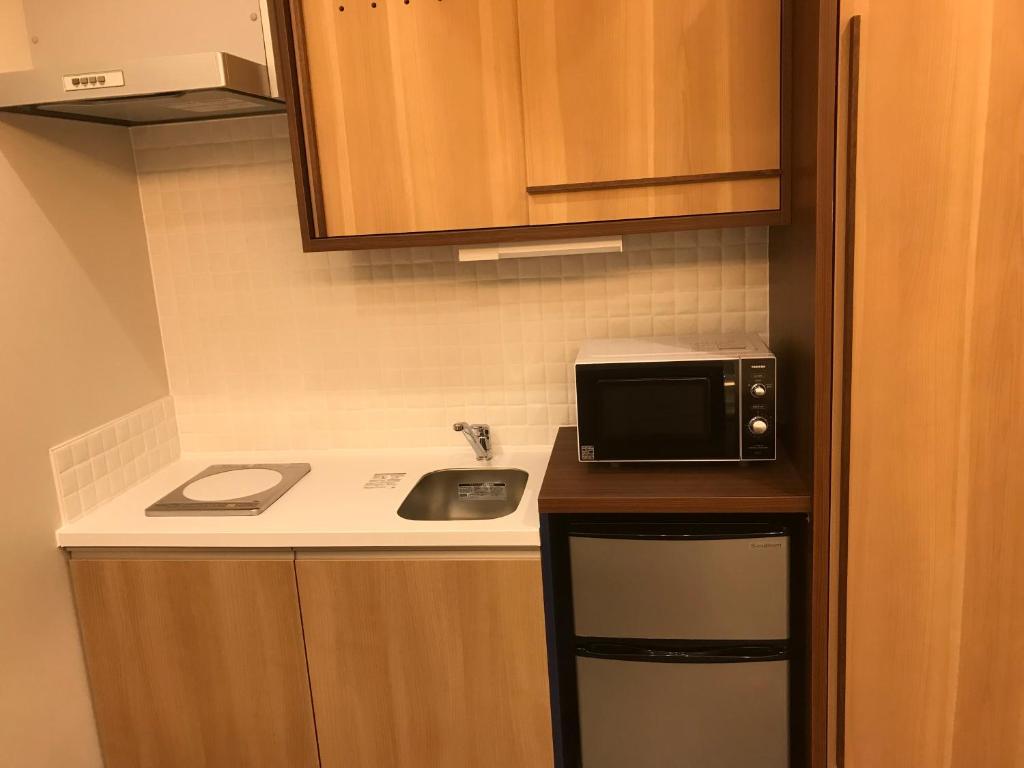 Kuchyň nebo kuchyňský kout v ubytování Hotel Yururito Osaka