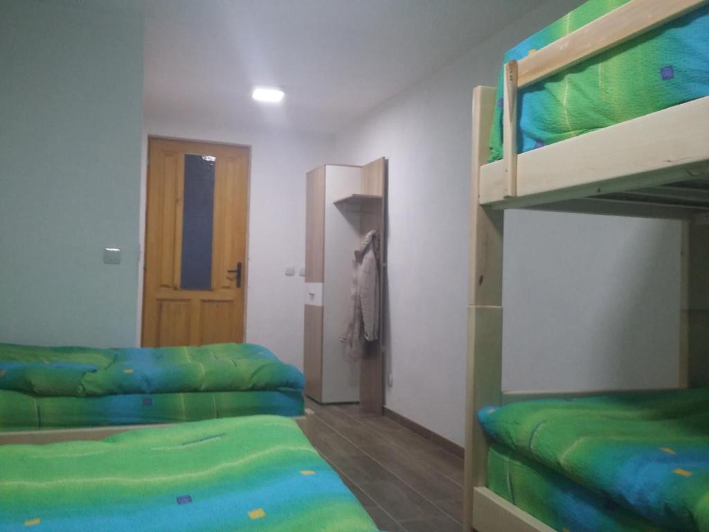 Postel nebo postele na pokoji v ubytování Domacinstvo Kod Gere