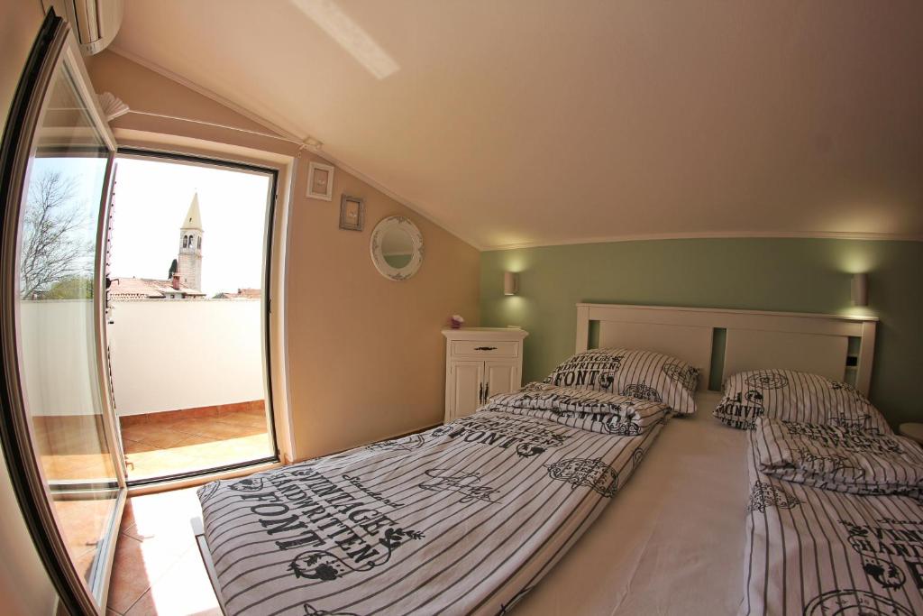 Postel nebo postele na pokoji v ubytování Room and Apartment Doris