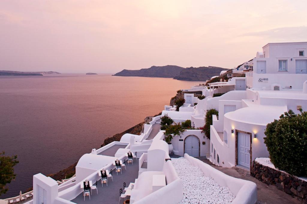 a view of the ocean and white buildings at Canaves Oia Boutique Hotel in Oia