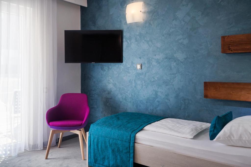 Postel nebo postele na pokoji v ubytování Hotel Porec