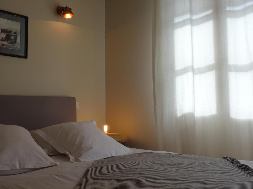 Postel nebo postele na pokoji v ubytování Les Chambres d'Andrea
