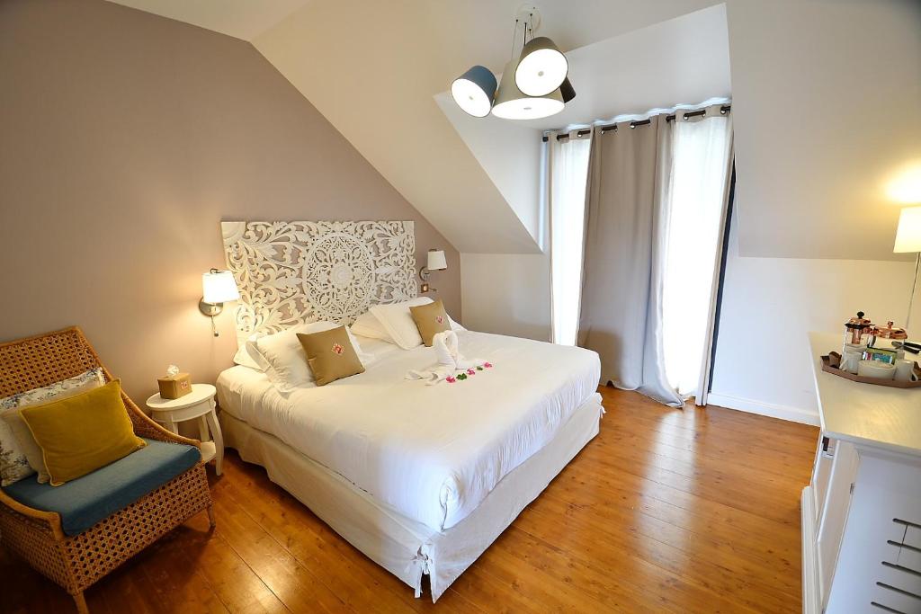 Postel nebo postele na pokoji v ubytování Tsilaosa Hôtel