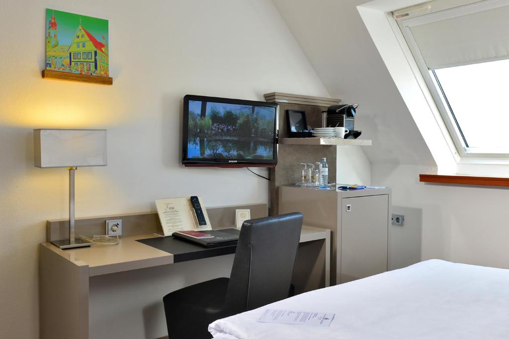 Kuchyň nebo kuchyňský kout v ubytování Hotel Caroline Mathilde