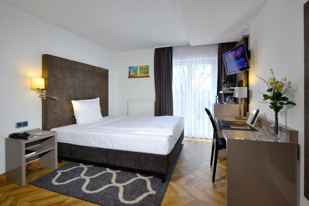 Postel nebo postele na pokoji v ubytování Hotel Caroline Mathilde